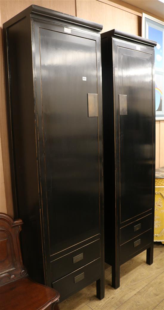 A pair of Lombok Chinese style black lacquered hanging cupboards, W.55cm